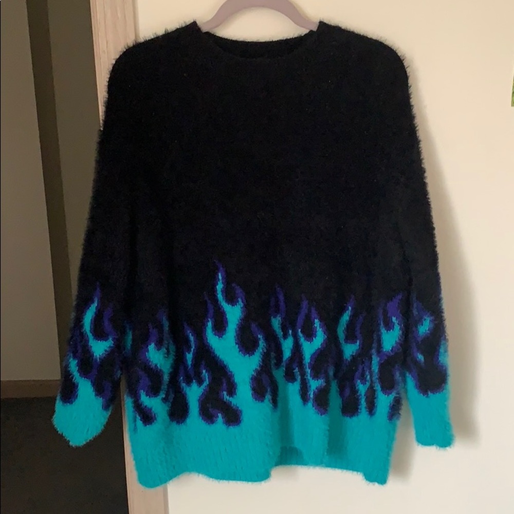 Adika “slow burn” blue flame sweater